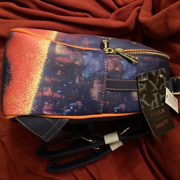 Loungefly Coco Marigold Bridge Mini Backpack